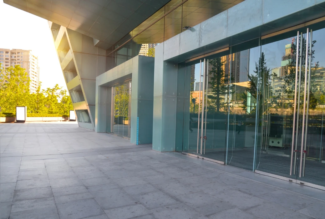 Generic store front with reflection of sun rise and trees